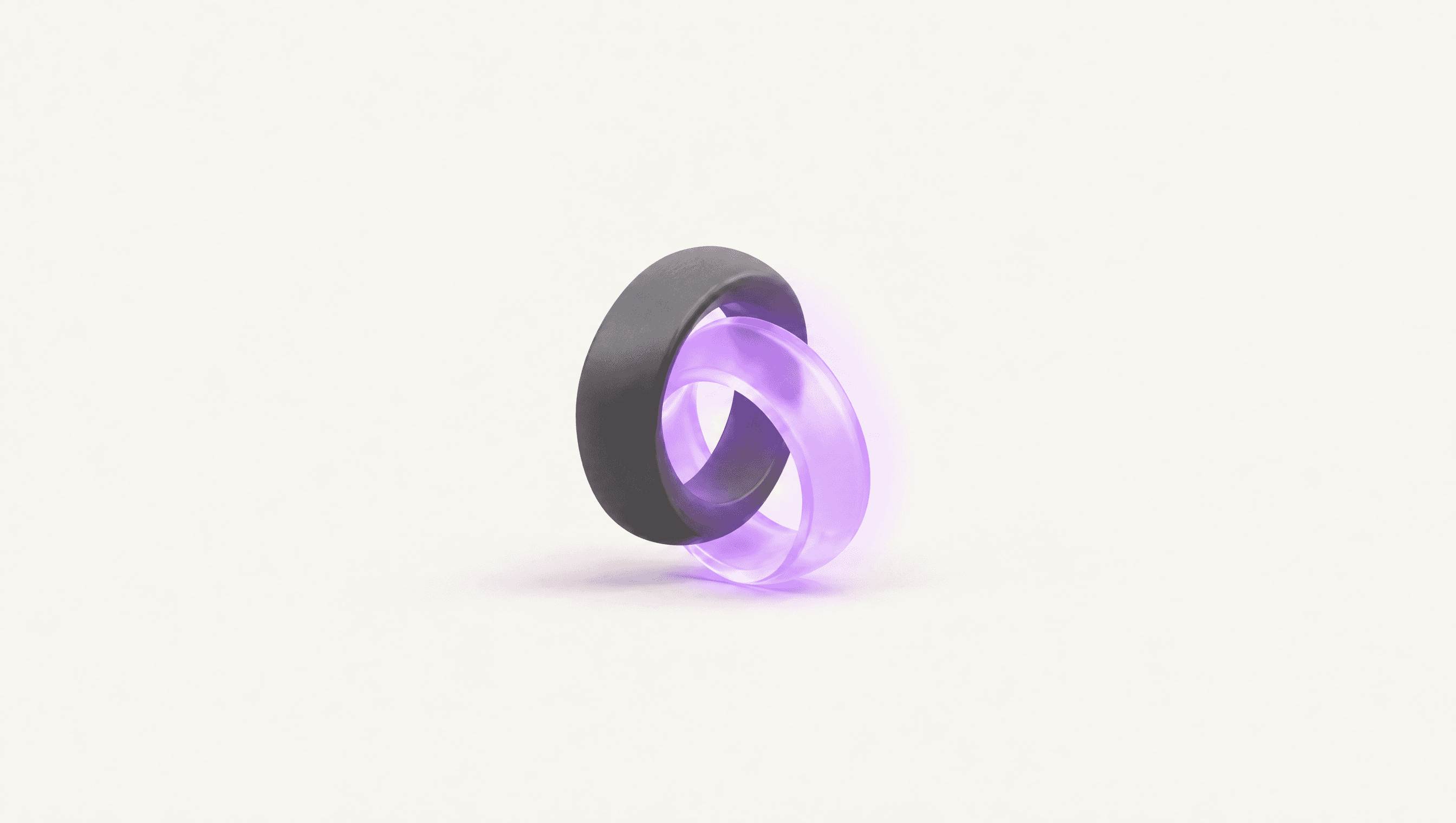 Two interlocked rings, one graphite and one violet glass